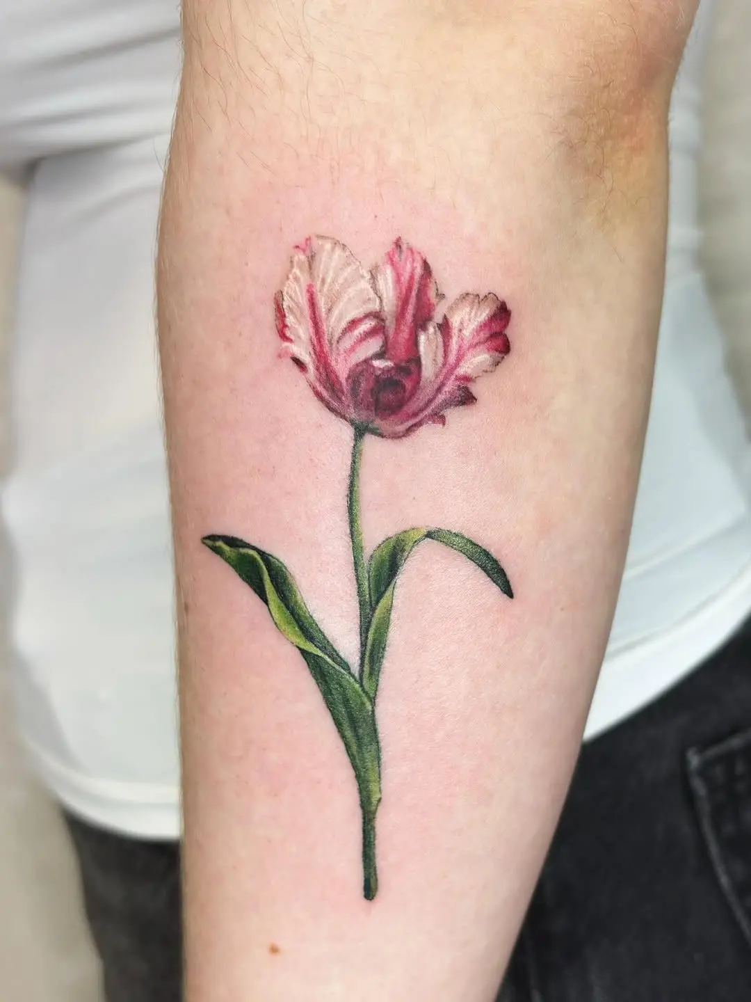 Stunning realistic tulip tattoo in vibrant colors