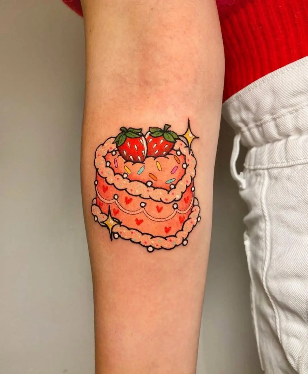 Whimsical strawberry cake tattoo delight