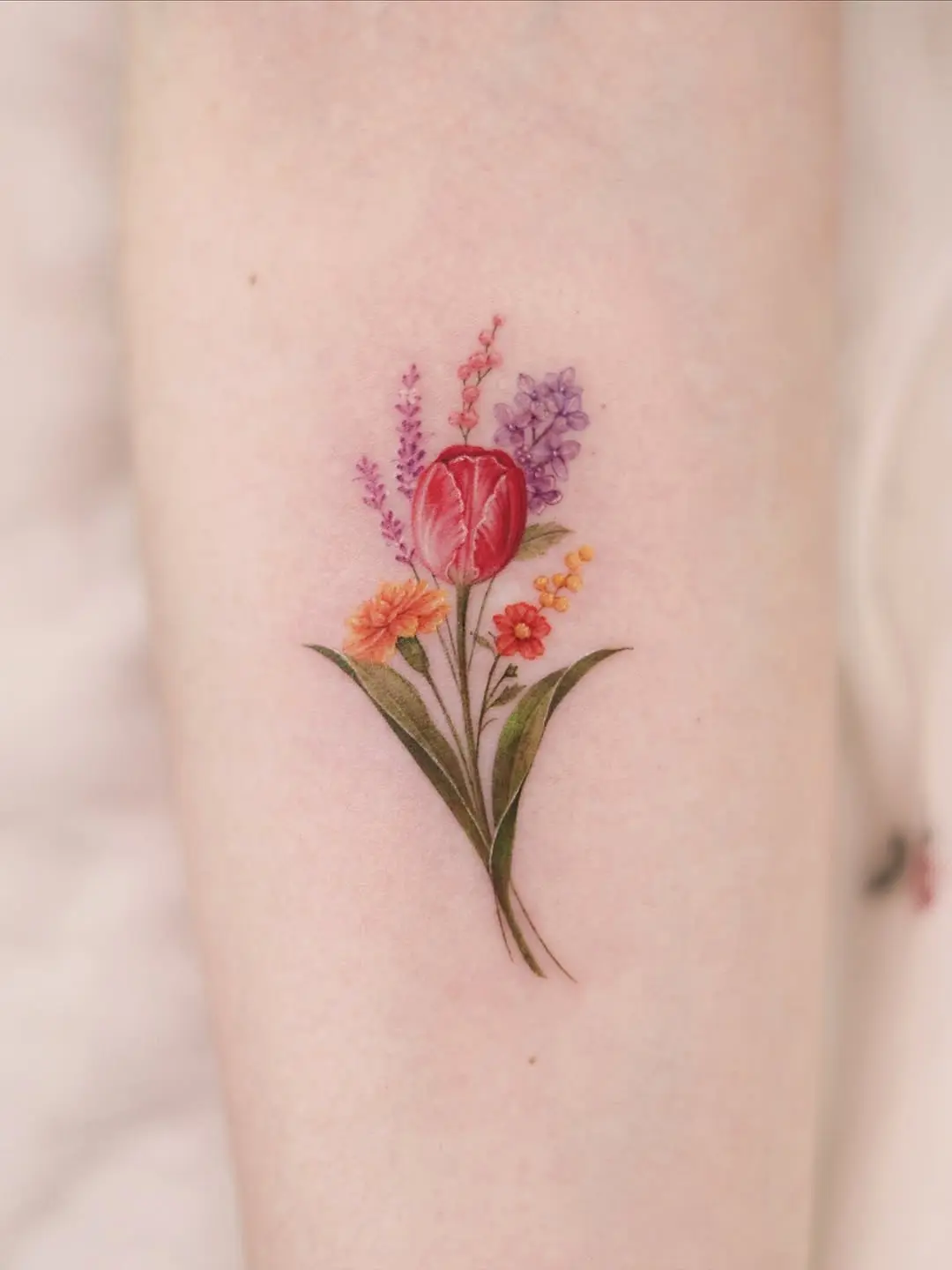 Vibrant tulip tattoo bursting with color