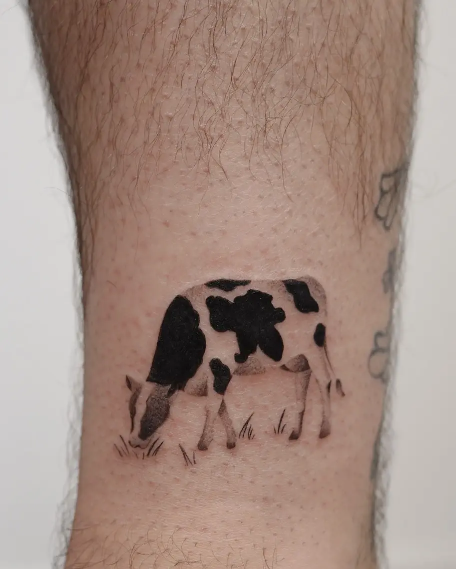 Charming cow tattoo in minimalistic design