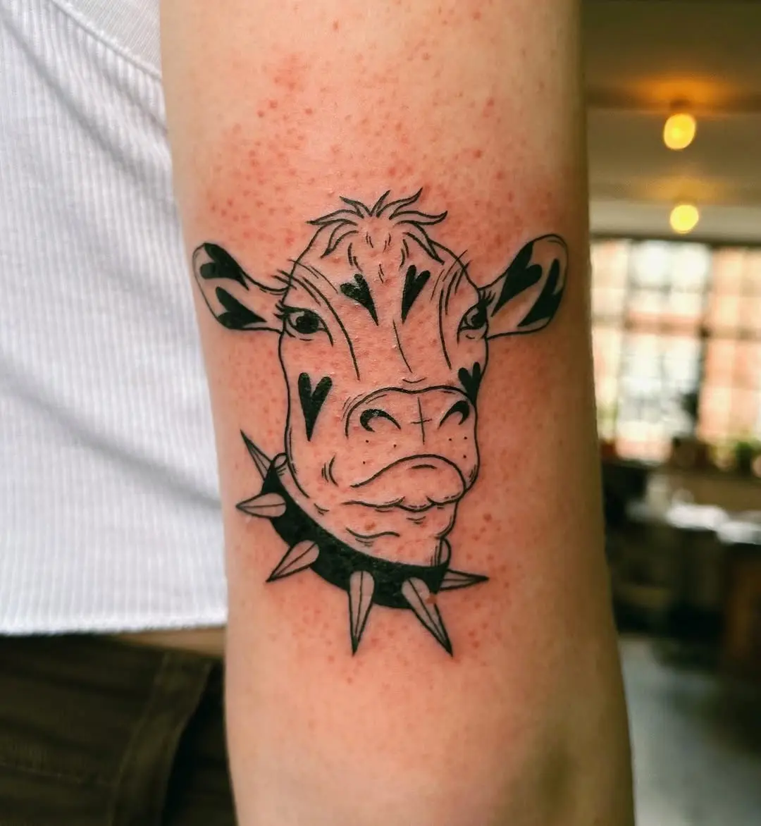 Unique Cow Tattoo with a Spiked Collar