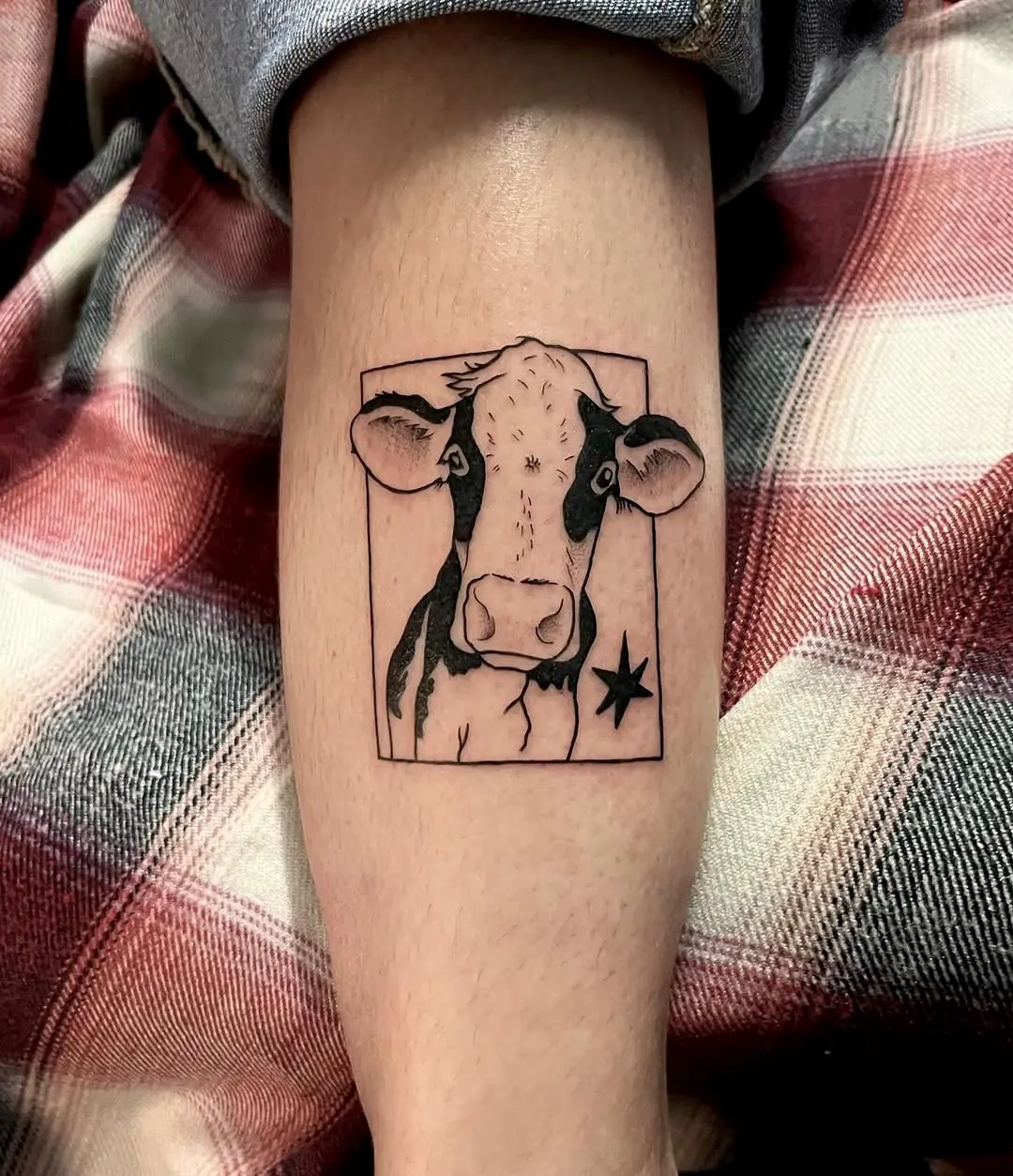 Charming minimalist cow tattoo for animal lovers