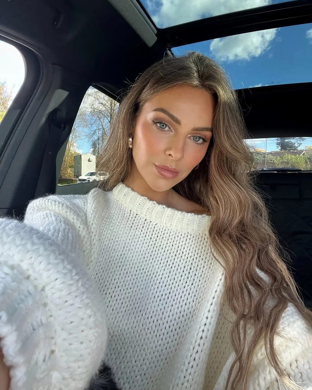 Casual Elegance in a Cozy Sweater Selfie