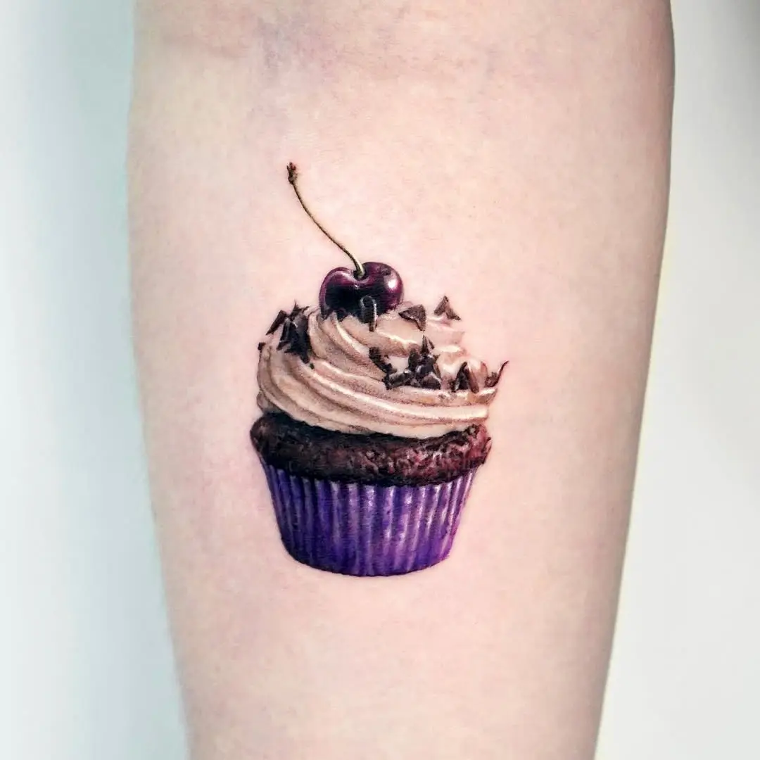 A delectable cupcake tattoo with vibrant colors