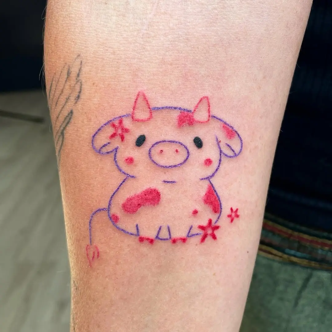 Adorable cartoon cow tattoo with colorful details