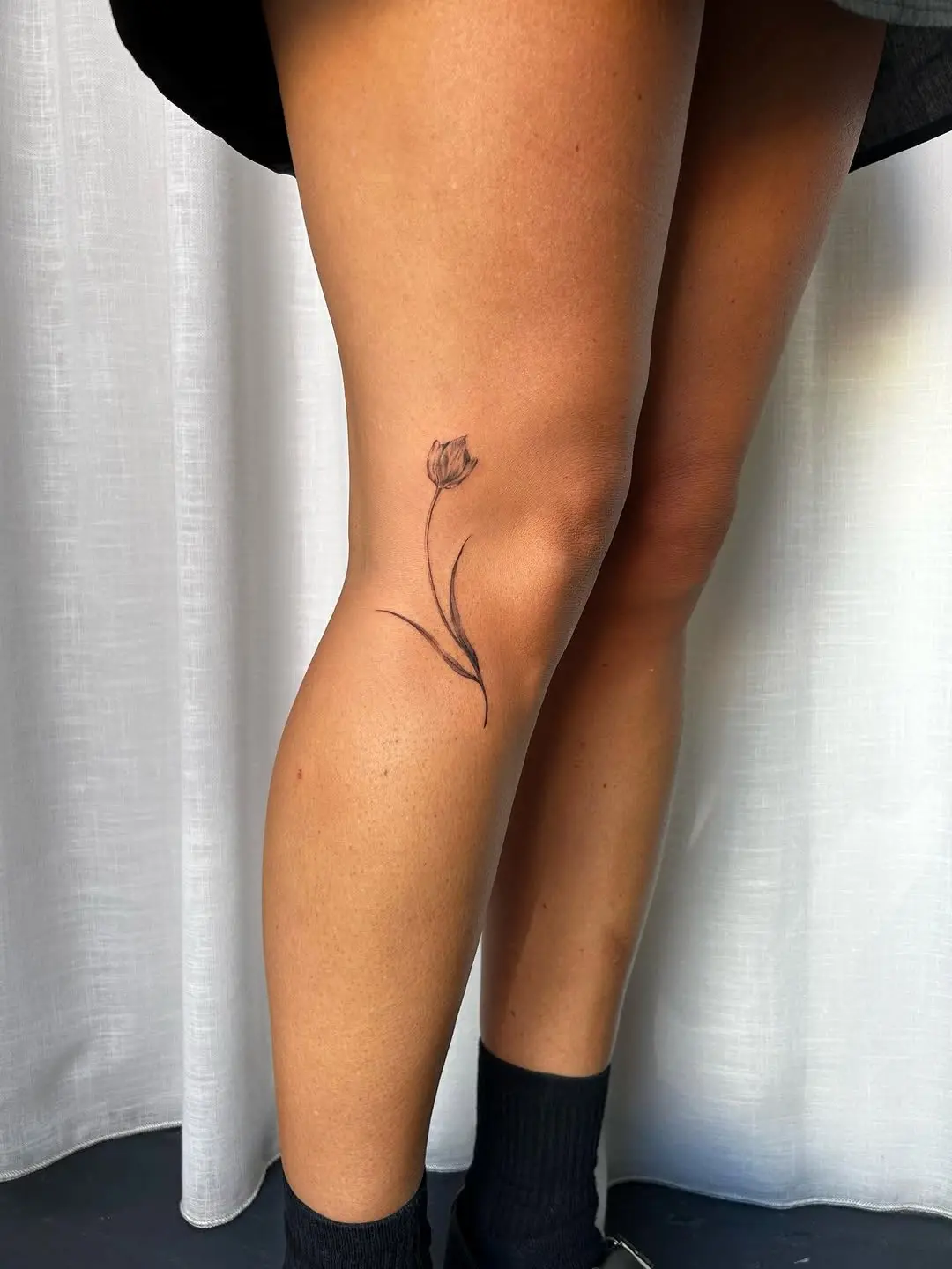 A simple yet elegant tulip tattoo design