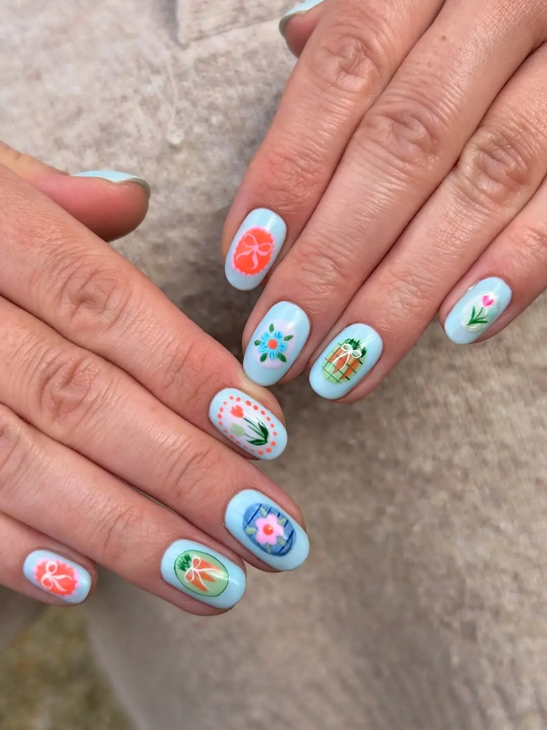 Colorful flowers and Easter patterns on nails