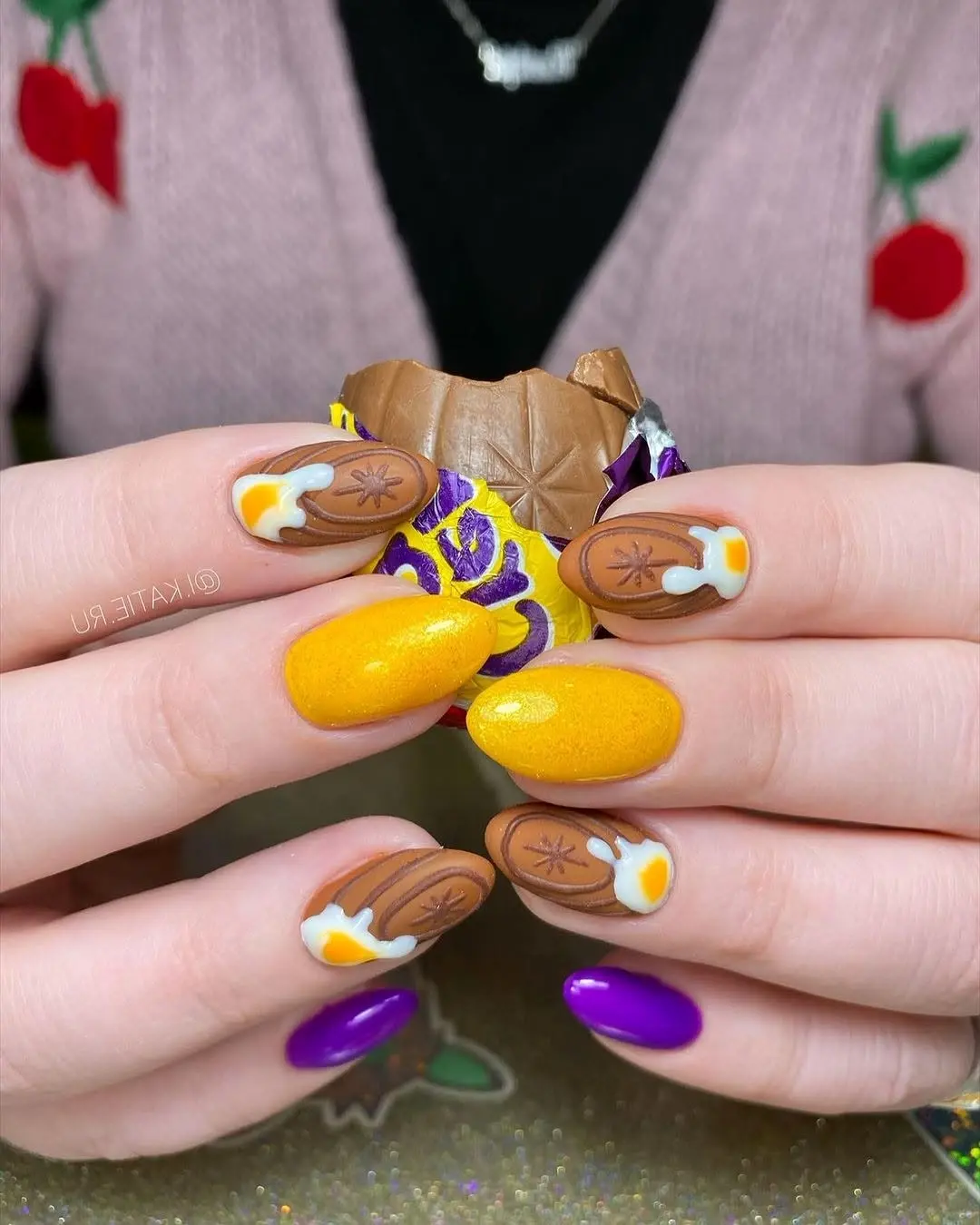 Colorful Easter nails with chocolate designs