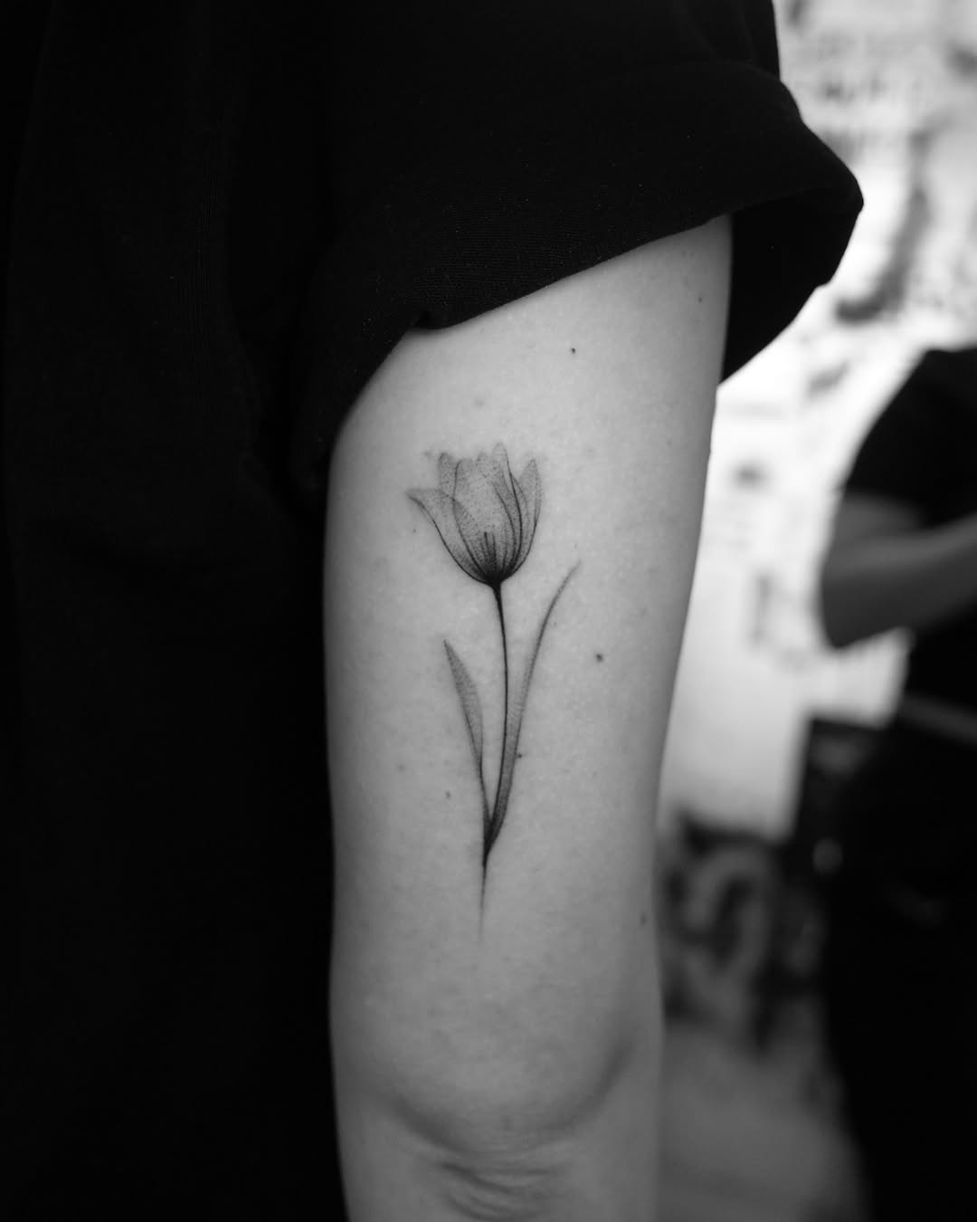 Stunning black and white tulip tattoo design