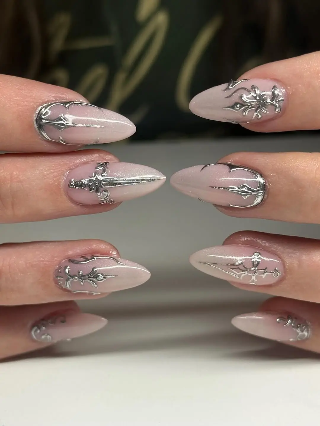 Sophisticated gothic nails with silver designs