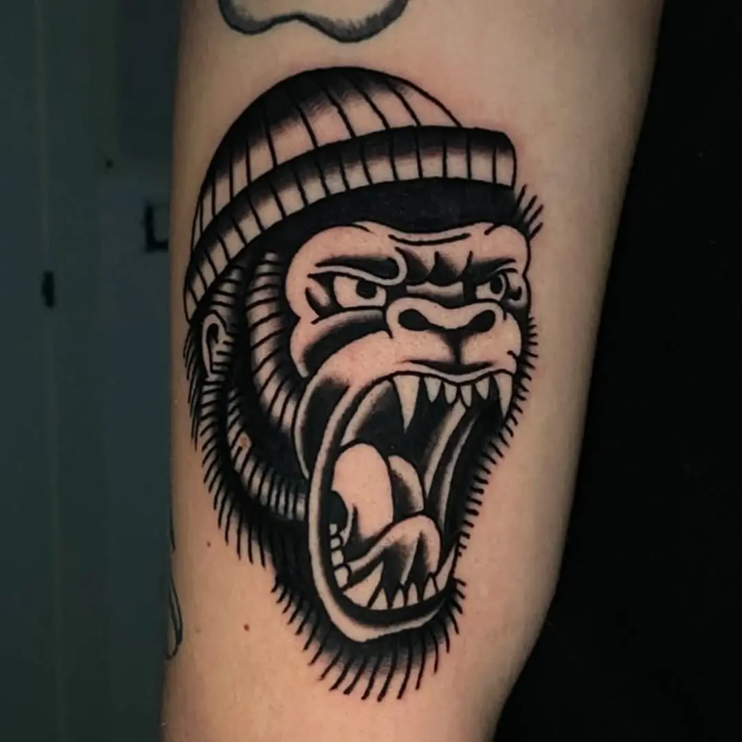 Bold gorilla tattoo exuding strength and attitude
