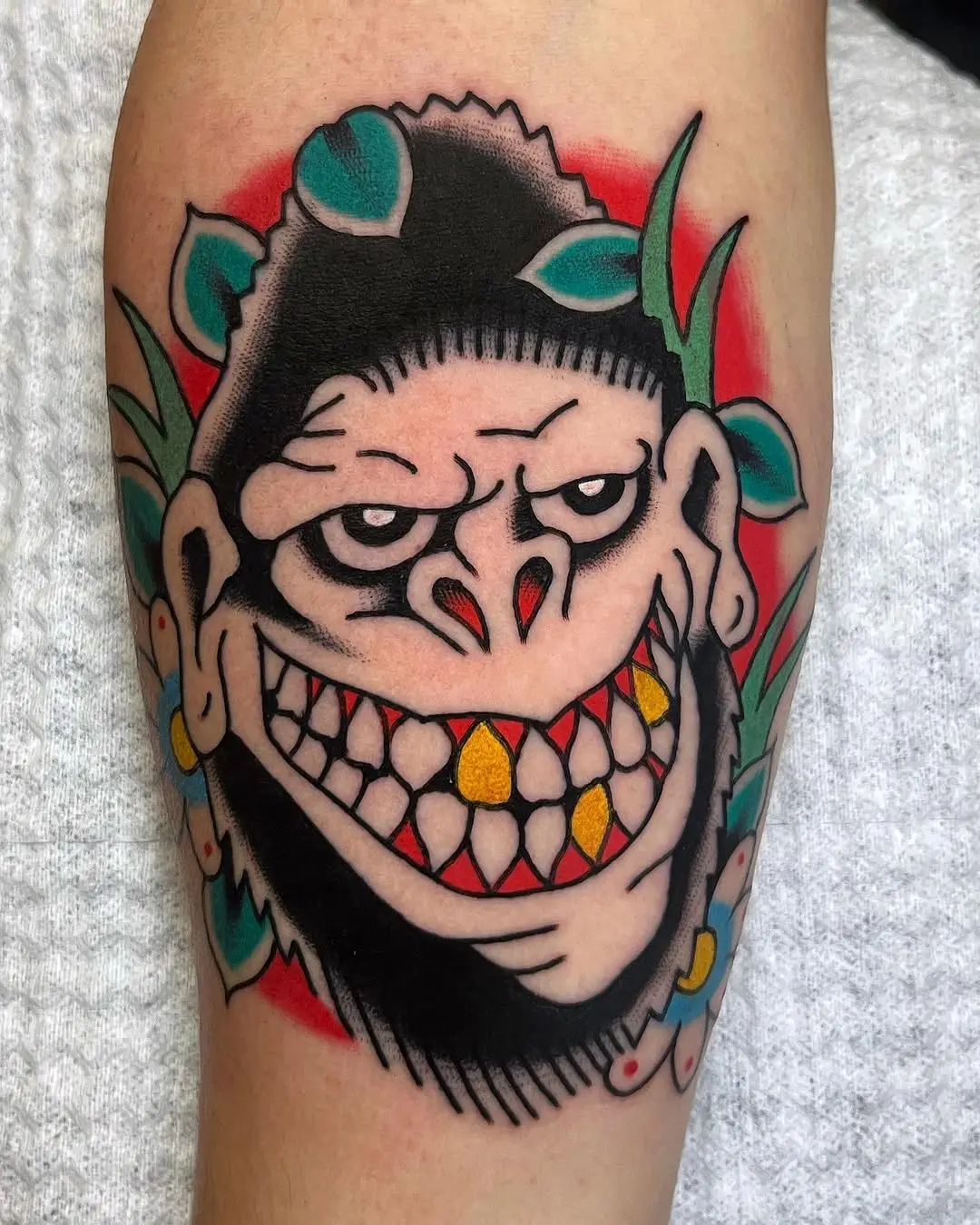 Playful Gorilla Tattoo with Bold Colors