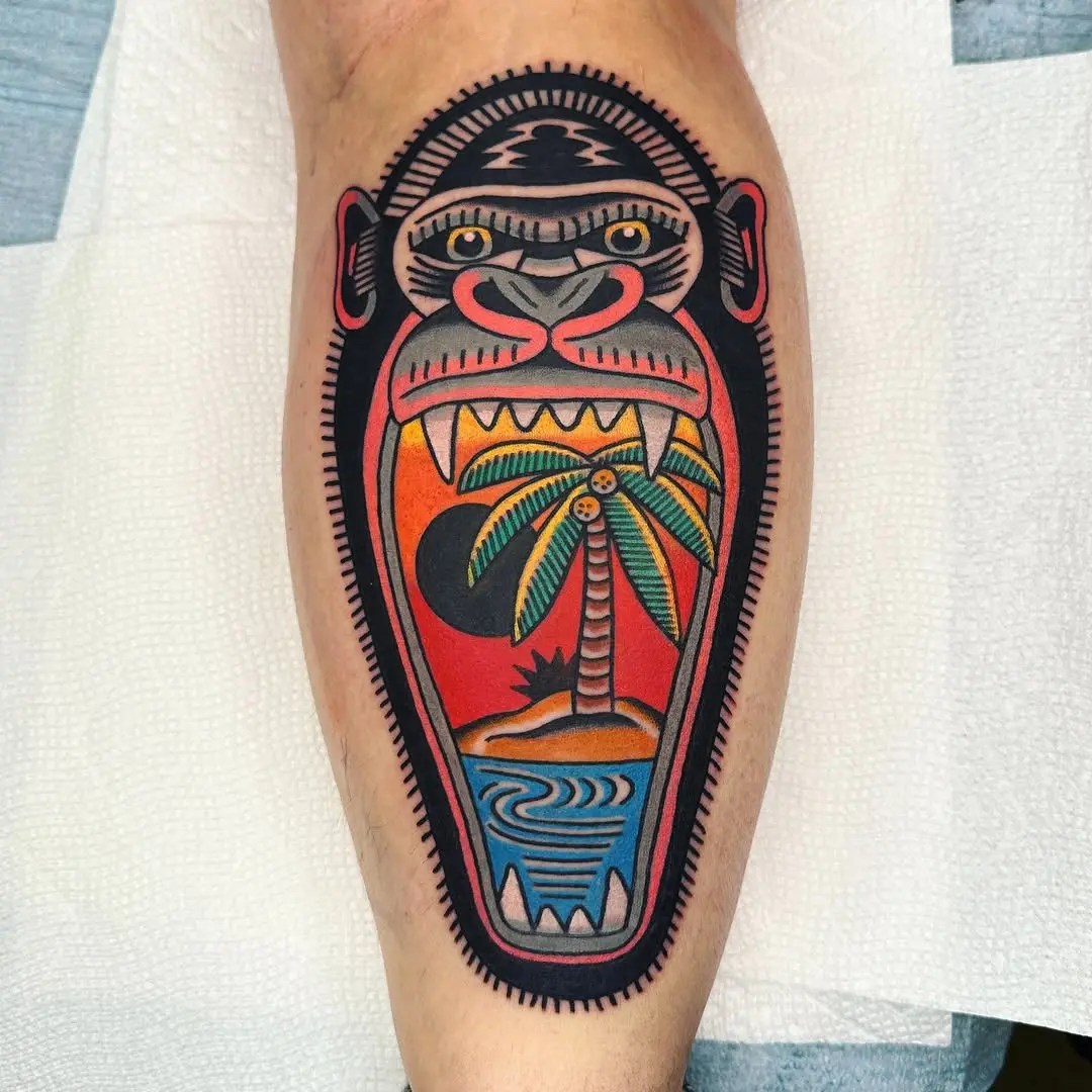 Vibrant gorilla tattoo featuring bold landscape detail