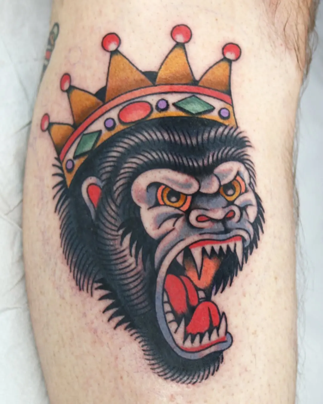 Bold Gorilla Tattoo with Royal Crown