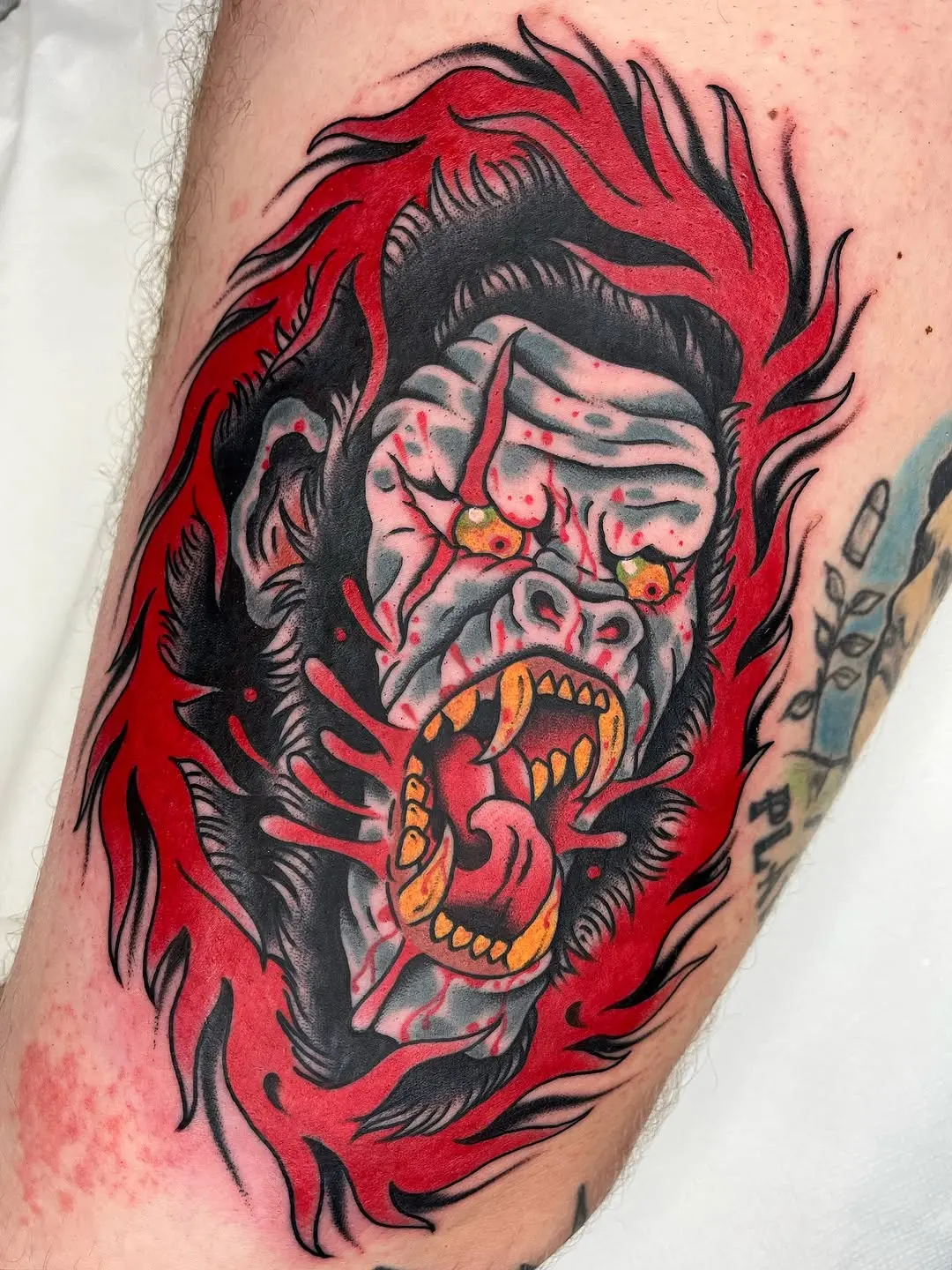 Aggressive gorilla tattoo in vibrant colors