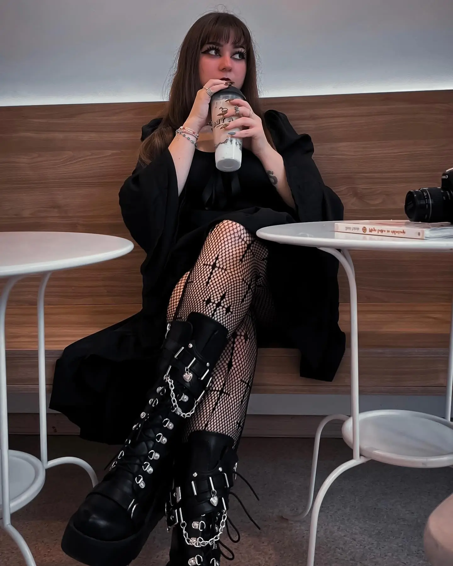 Chic goth look with edgy accessories and layers