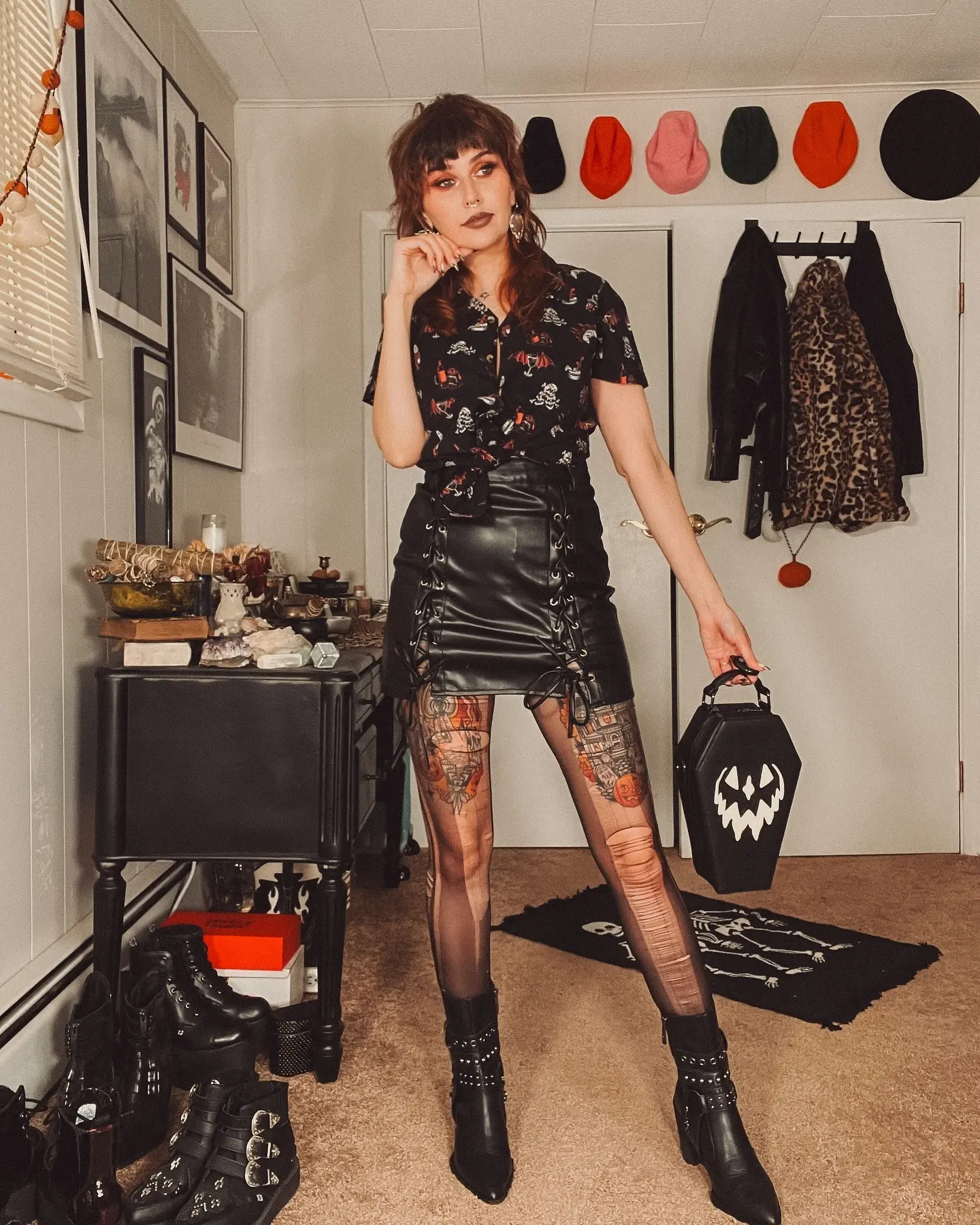 Stylish goth outfit with leather and tattoos