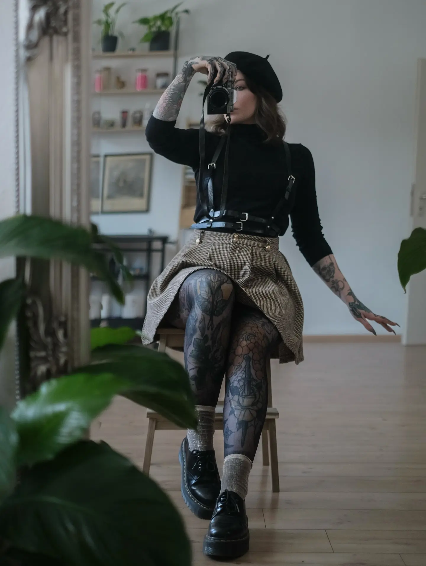 Chic goth style captured in mirror reflection.