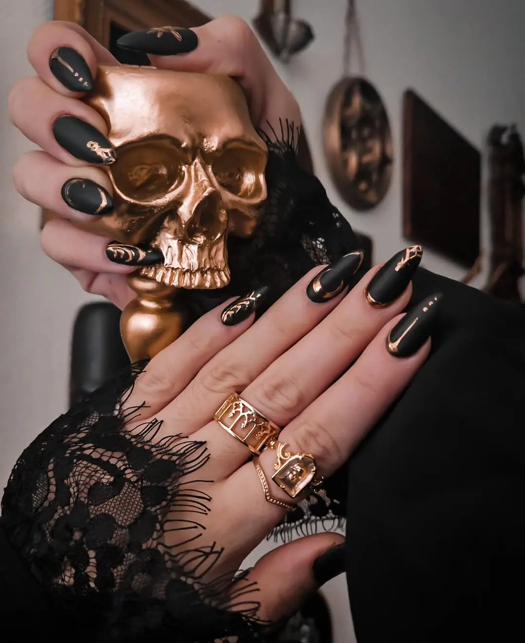Elegant gothic nails with lace and skull accents
