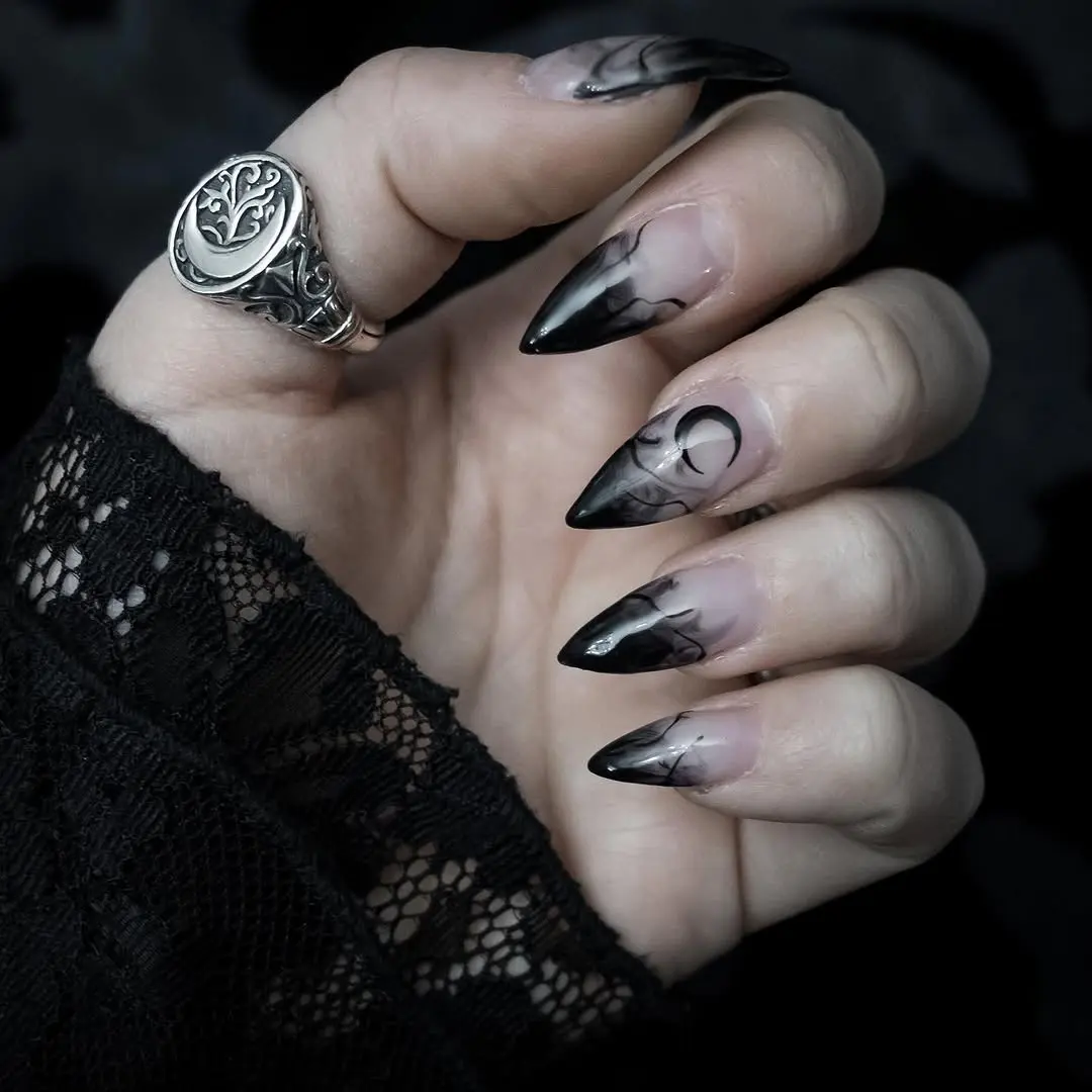 Stunning black marble gothic stiletto nails