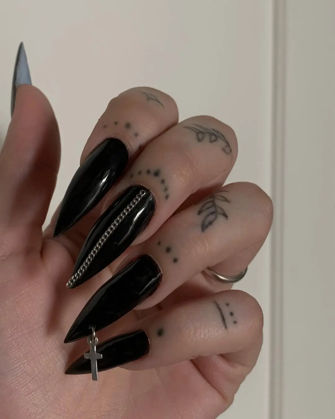 Sharp black nails with striking accessories