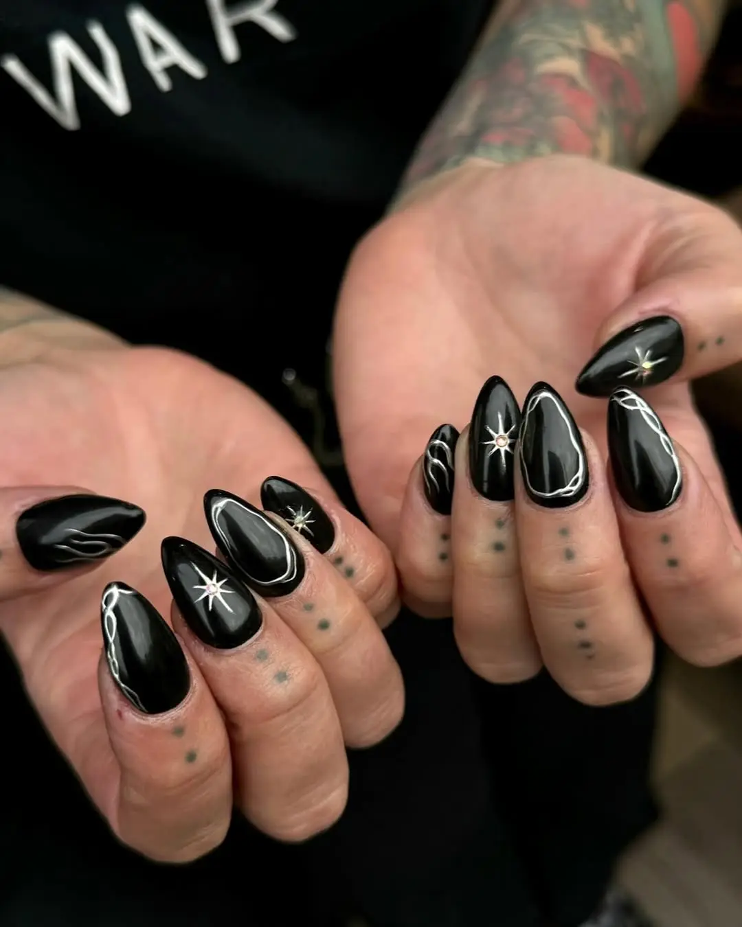 Stylish gothic black nail art with stars