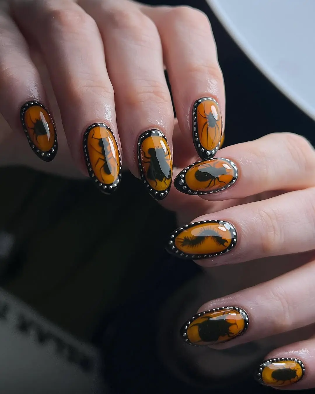 Stylish Gothic Nails with Orange and Black Art