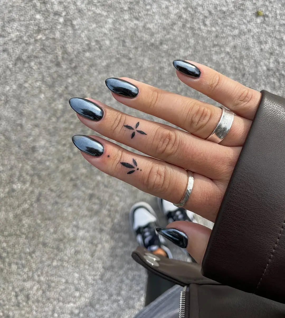Sleek silver and black gothic nail design