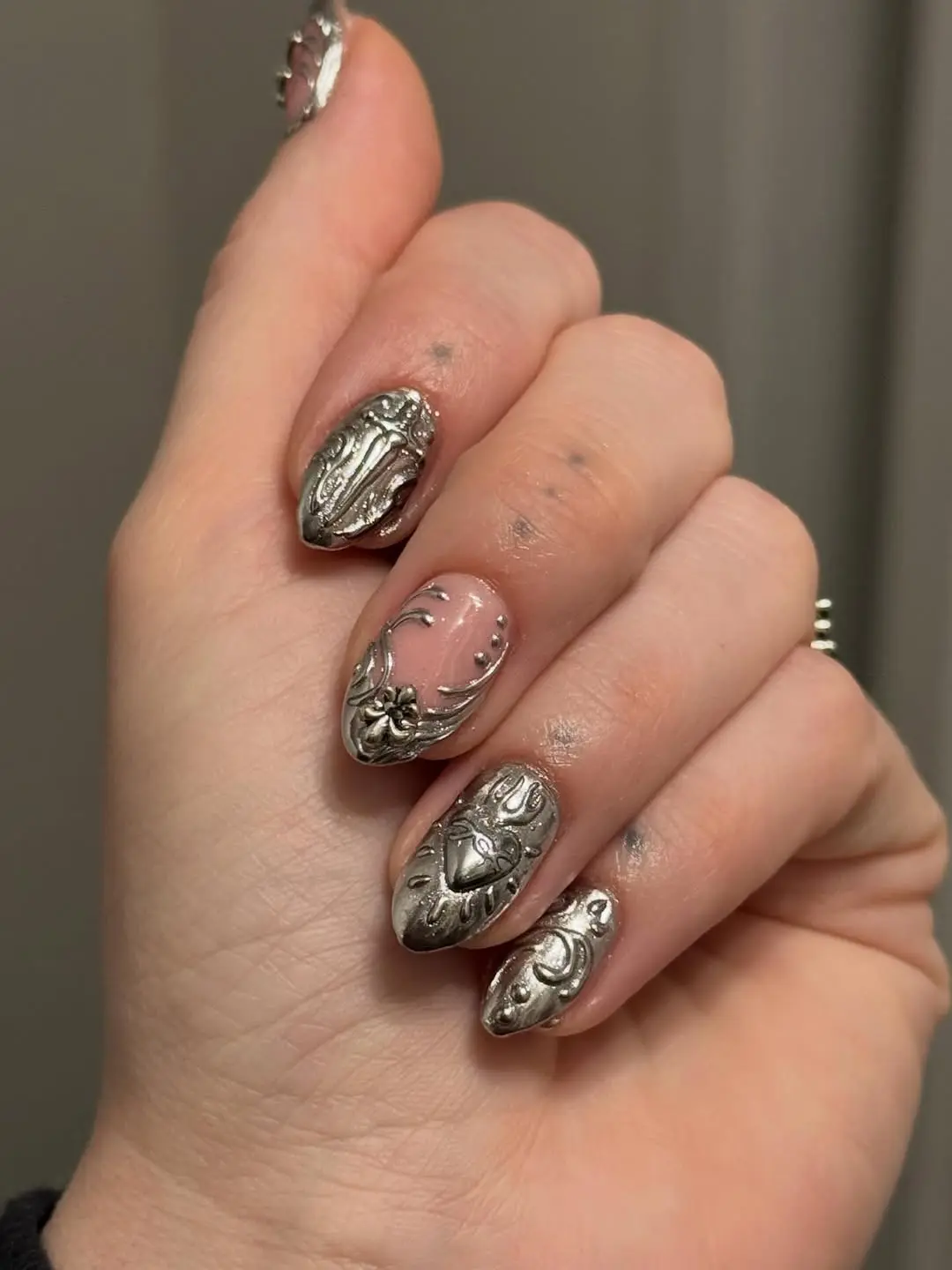 Elegant gothic nails with intricate silver designs