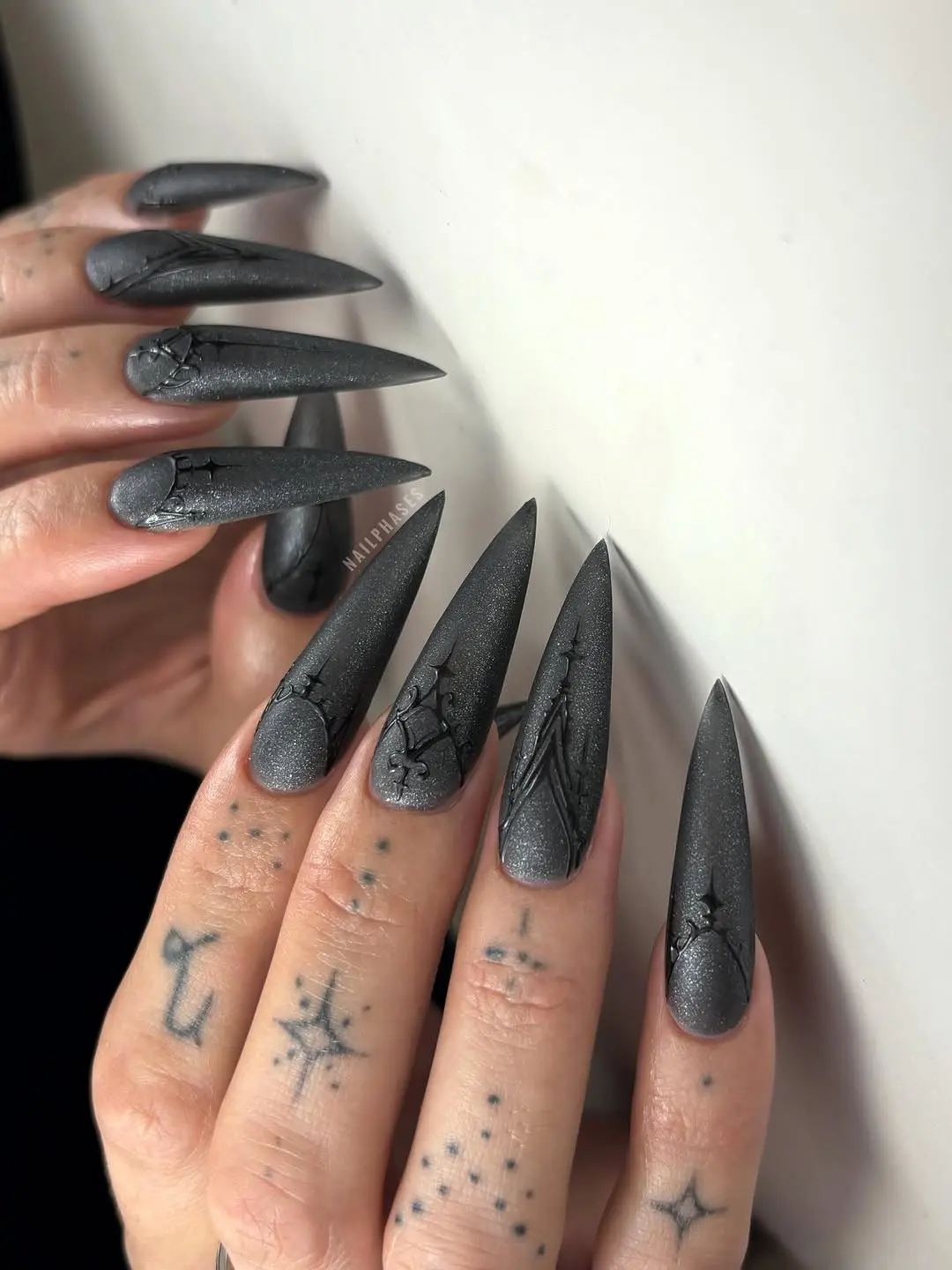 Striking gothic nails with bold dark designs