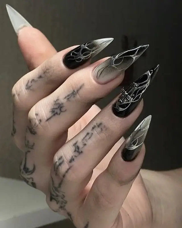 Stunning gothic stiletto nails with intricate designs
