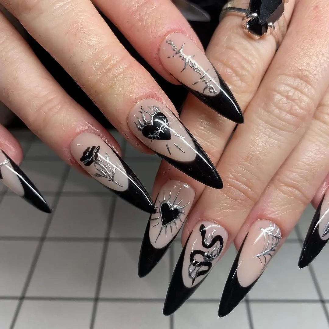Stylish Gothic Stiletto Nails with Intricate Art
