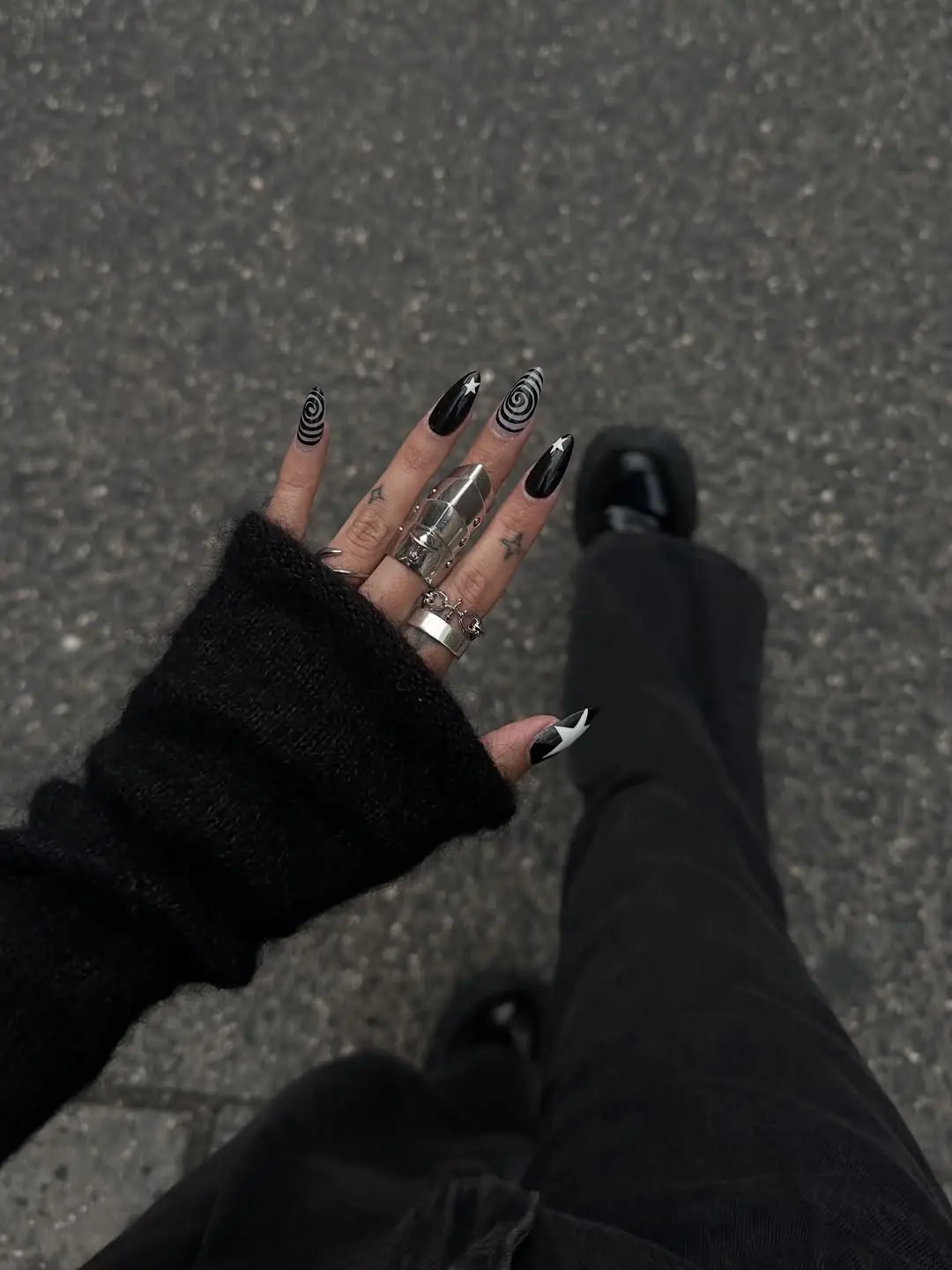 Chic black and white spiral nail design