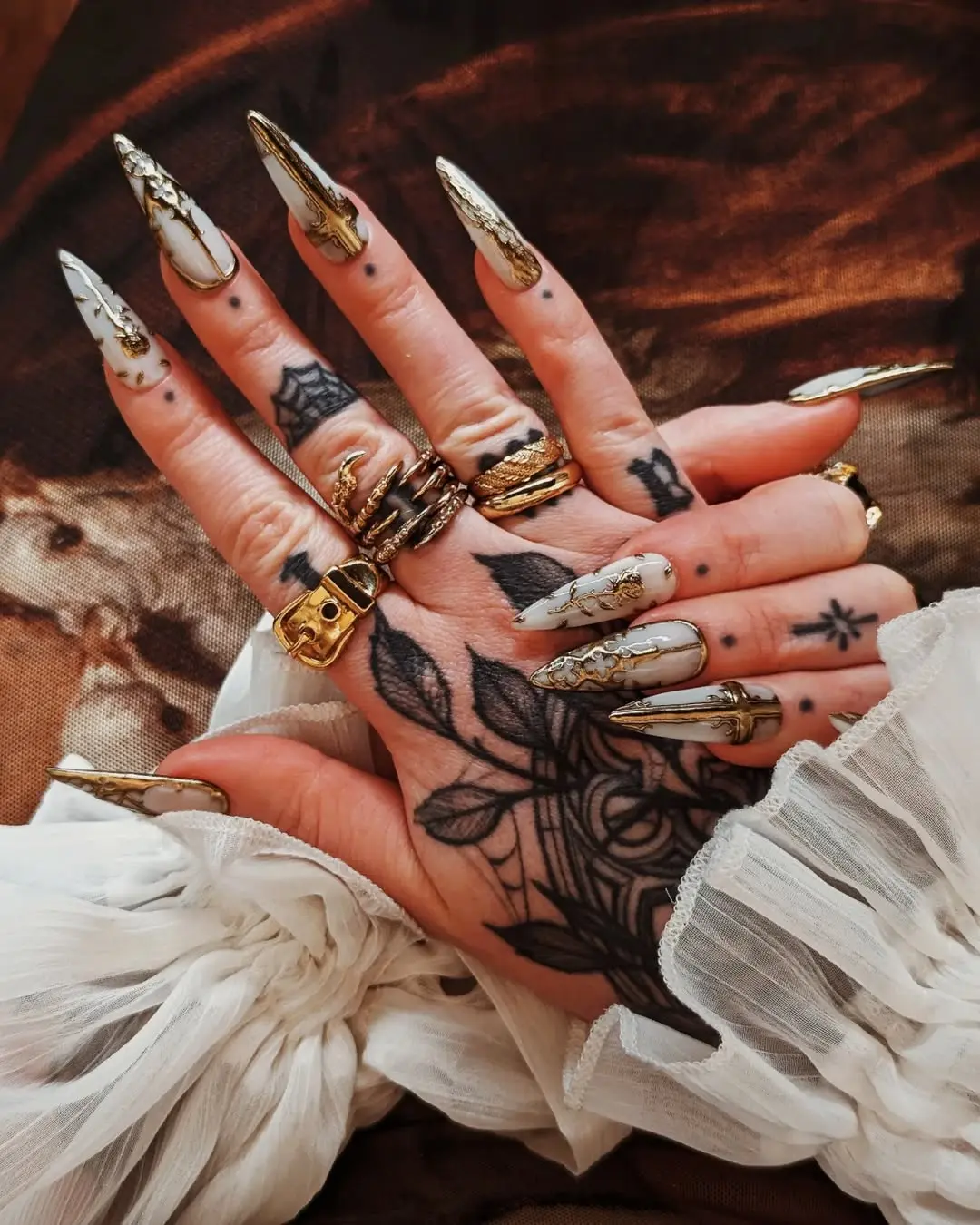 Elegant Gothic Nails with Intricate Gold Accents