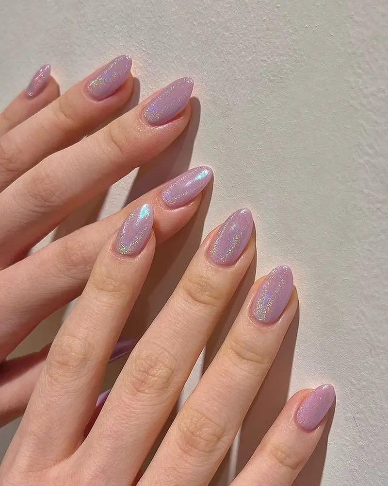 Sparkling iridescent purple unicorn nail design