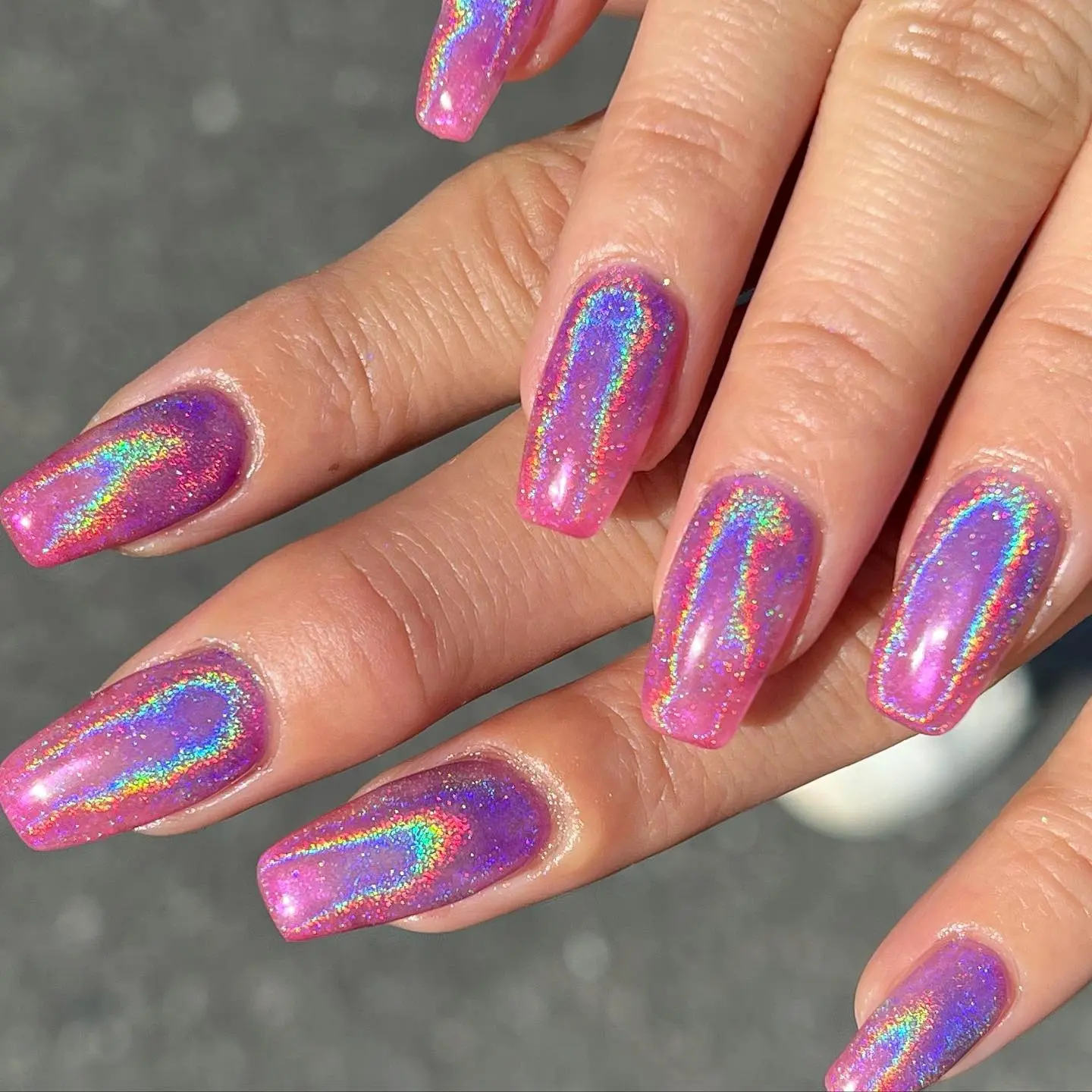 Vibrant pink and purple unicorn-inspired nails