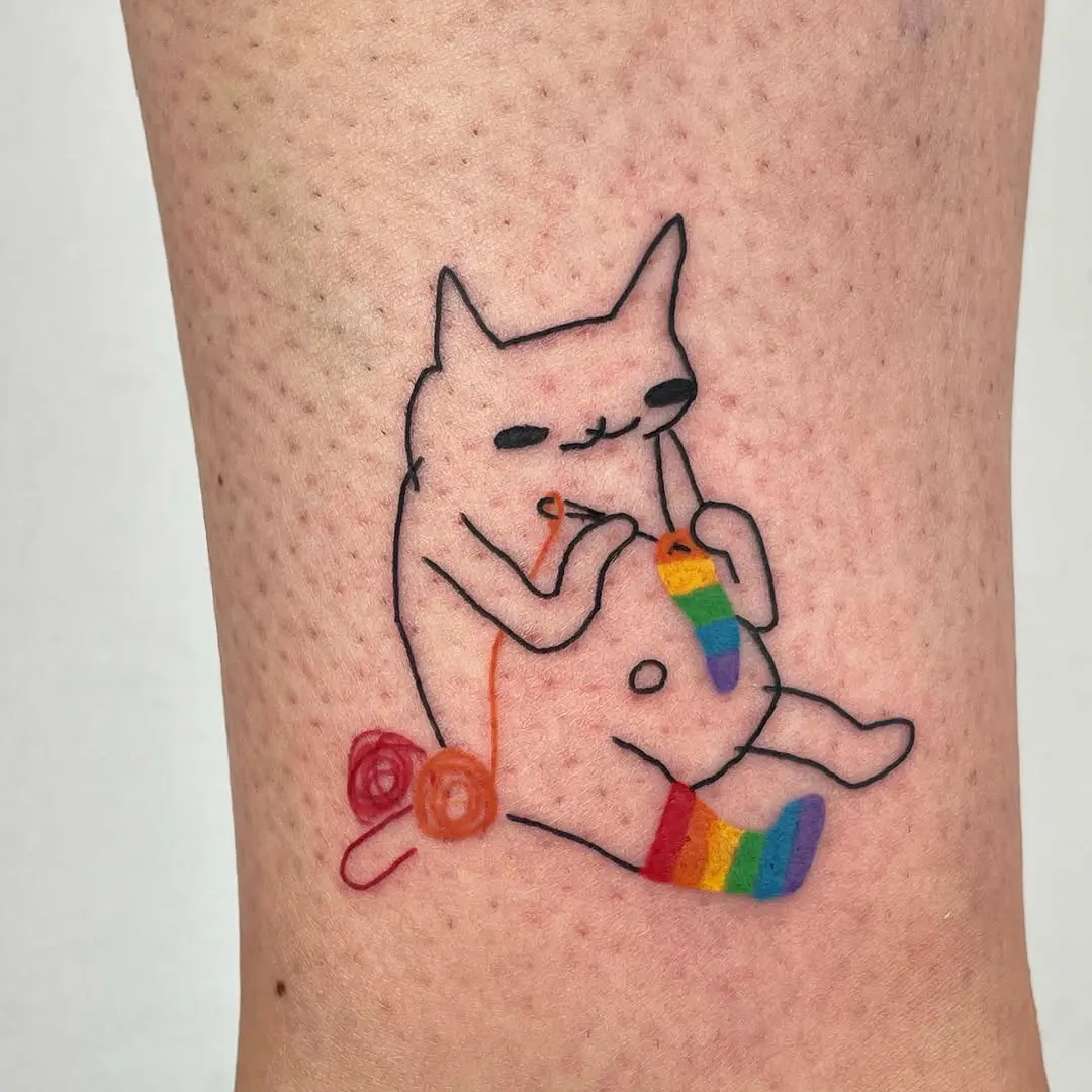Playful cat tattoo celebrating LGBT pride
