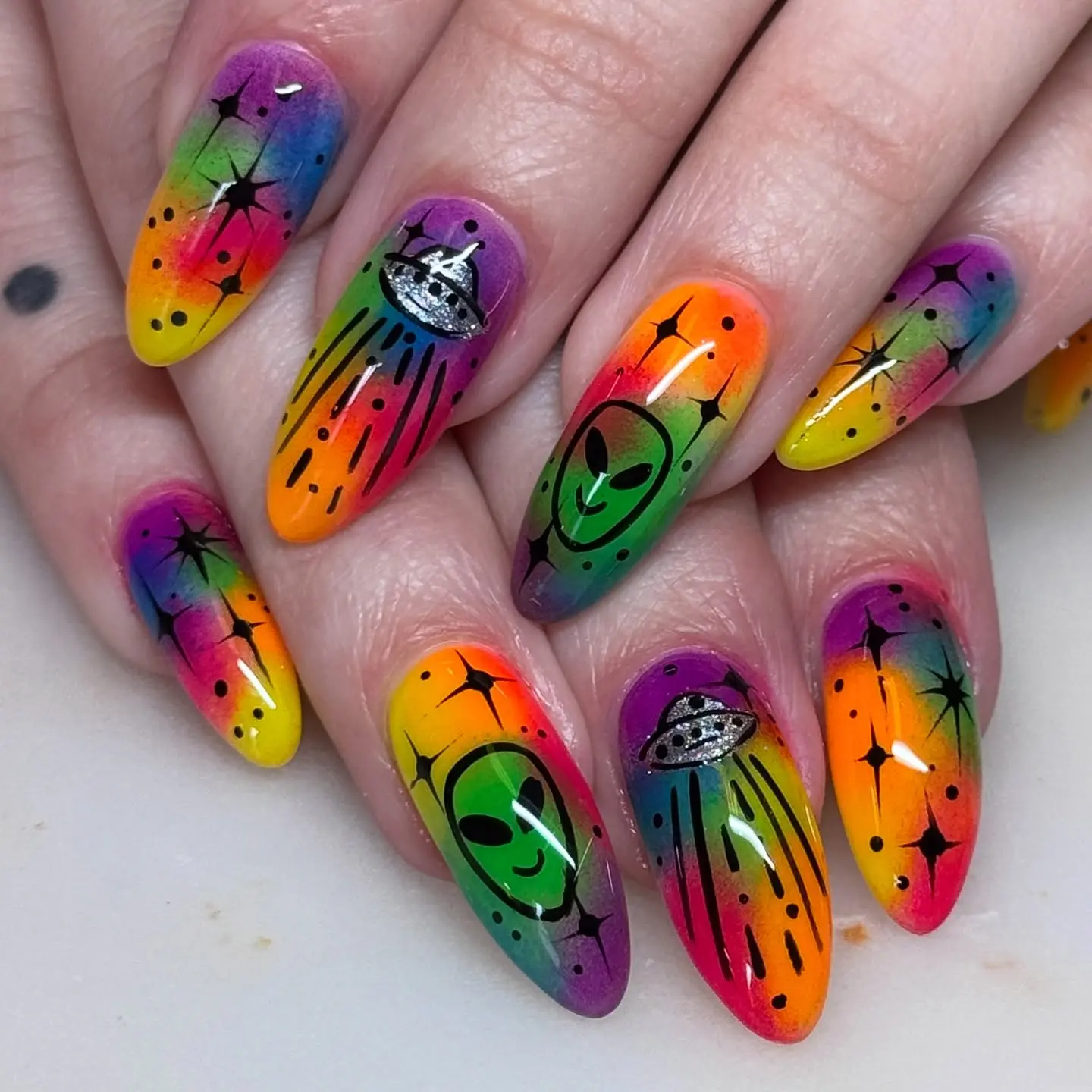 Vibrant Alien-Inspired Nails with Outer Space Theme