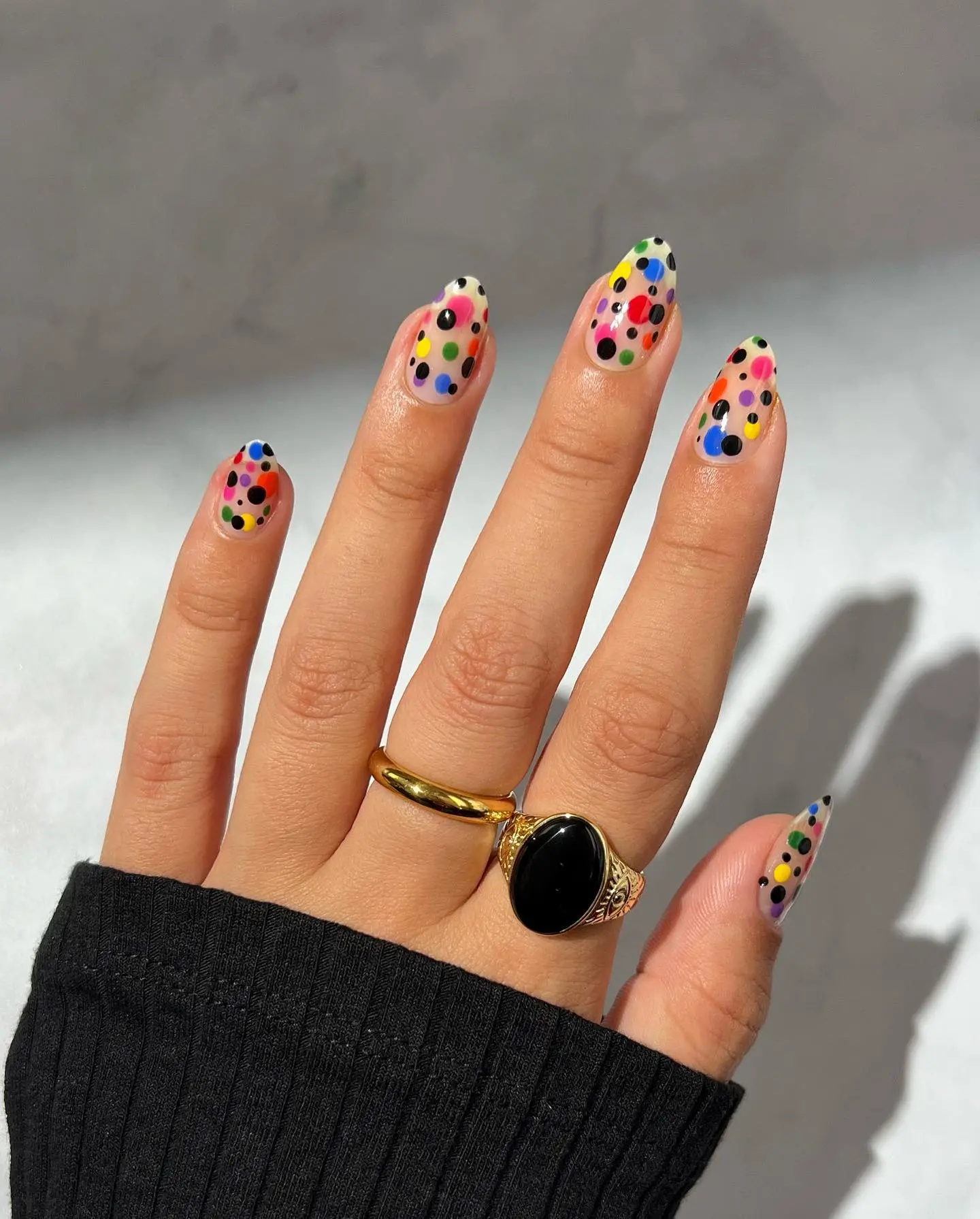 Colorful polka dot nails with vibrant flair