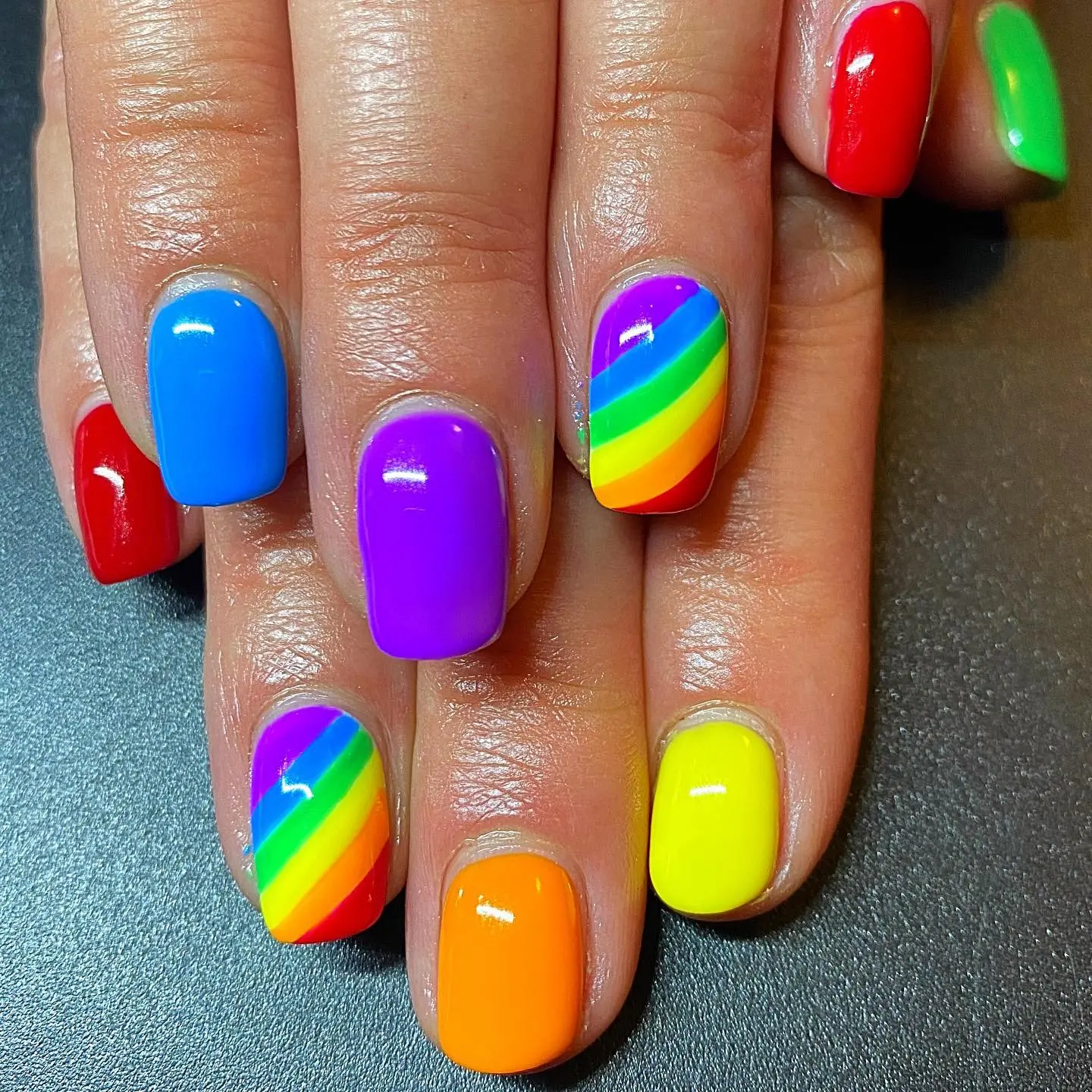 Colorful rainbow nails celebrating pride and joy