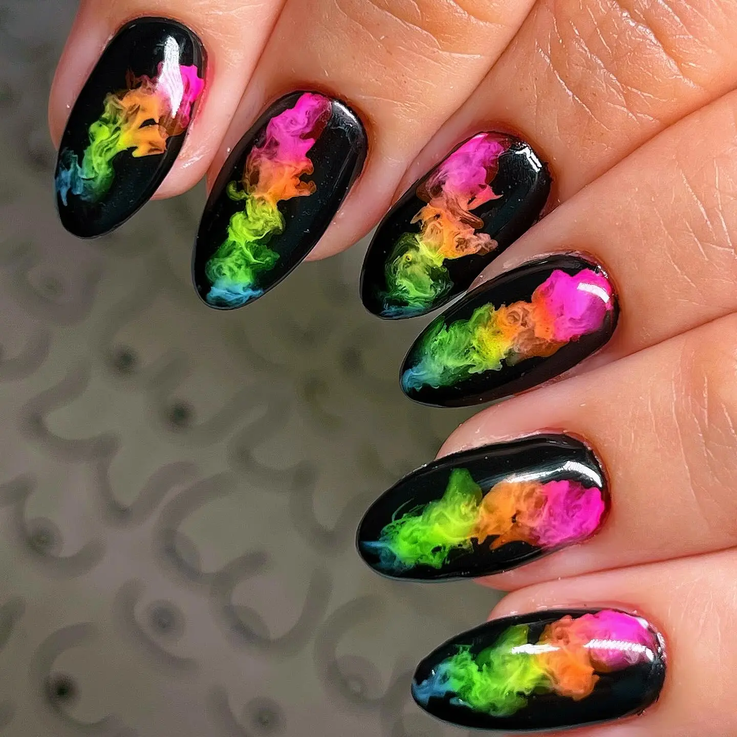 Vibrant rainbow smoky design on nails