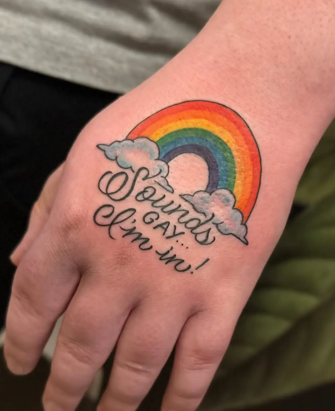 Colorful hand tattoo celebrating LGBTQ+ pride
