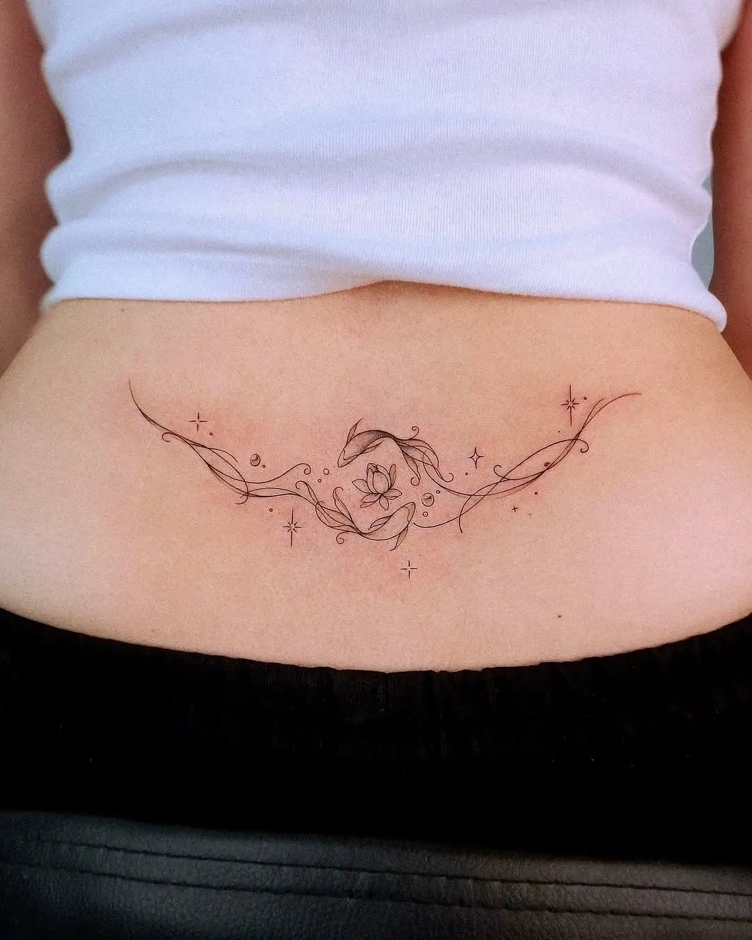 Elegant floral design for lower back tattoo