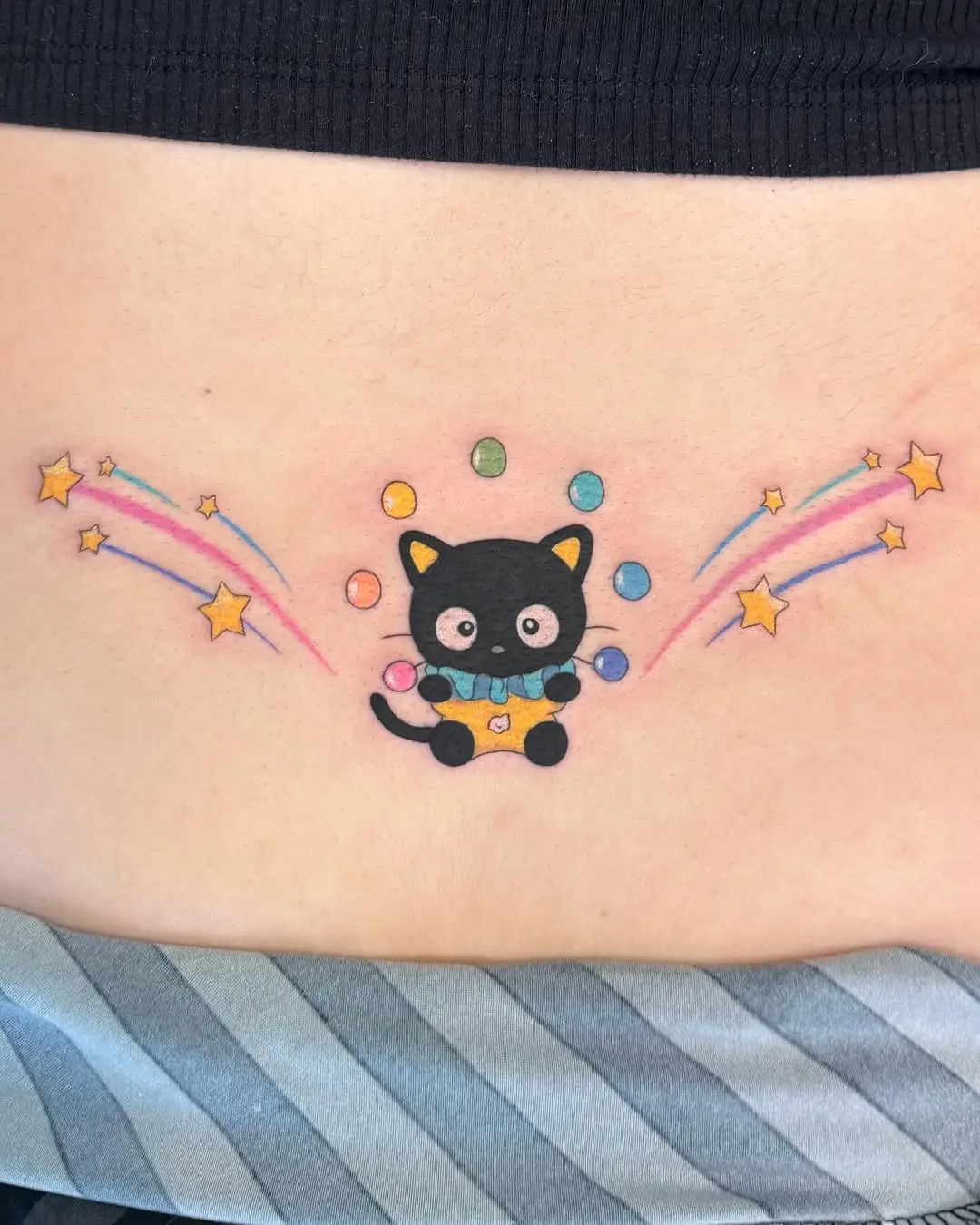 Playful cat design with colorful elements