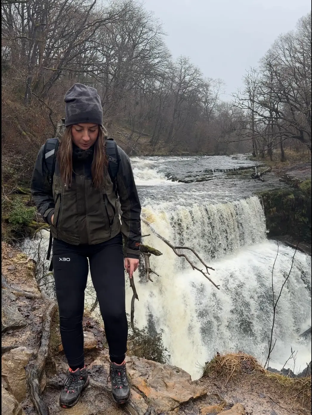 Stylish Hiking Outfit by a Waterfall