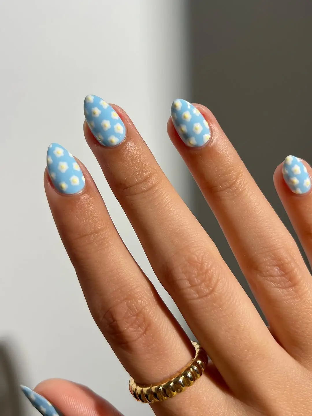 Charming pastel nails with white floral accents