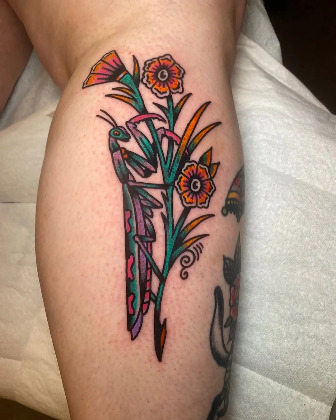 Vibrant praying mantis with floral elements