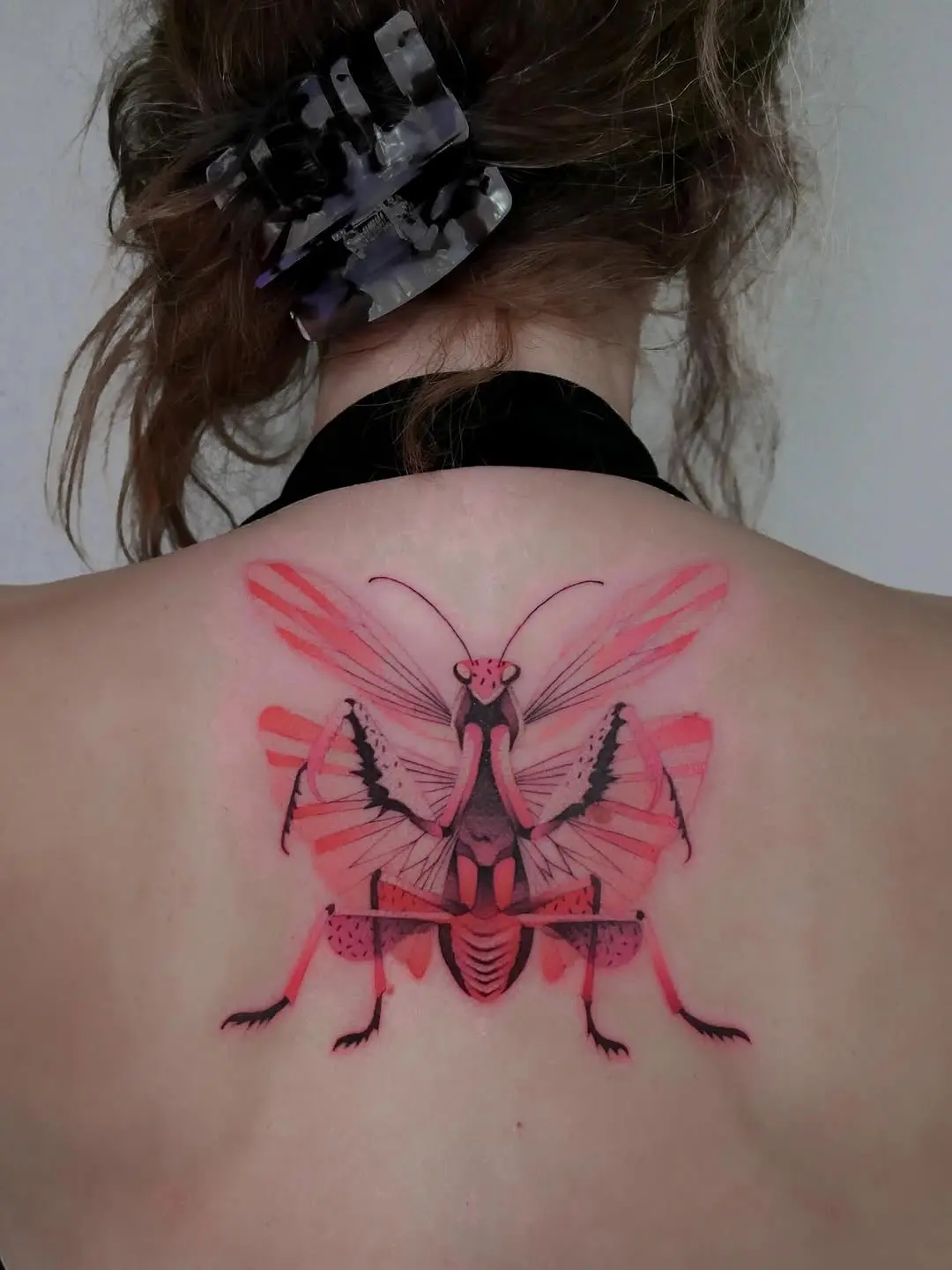 Stunning vibrant praying mantis tattoo design