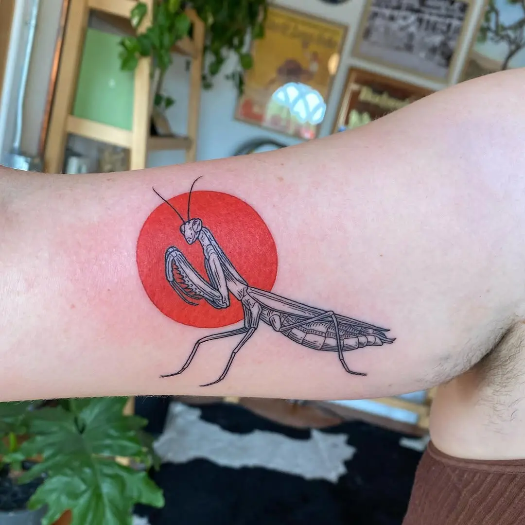 Bold praying mantis tattoo on vibrant backdrop