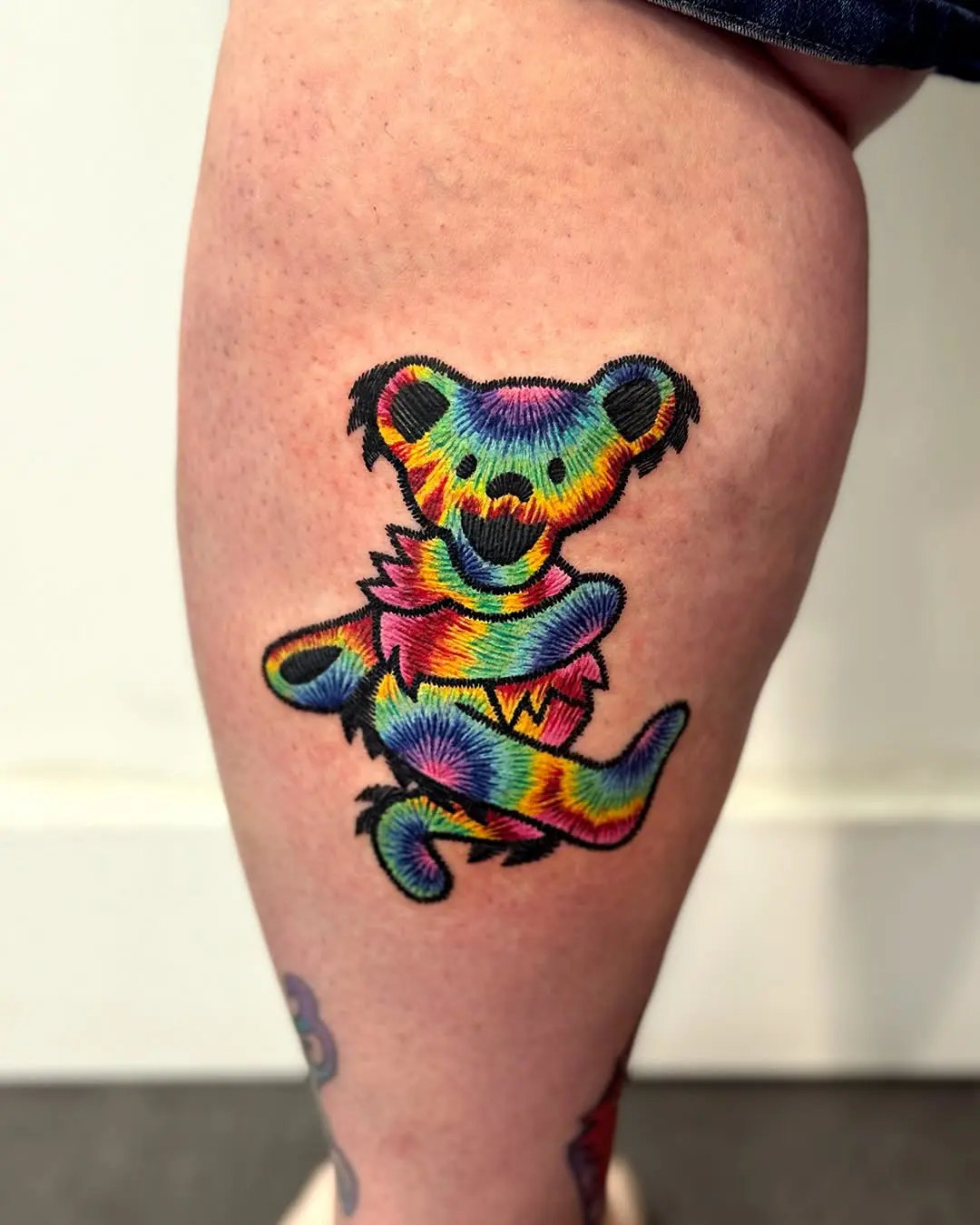 Vibrant rainbow koi fish tattoo design